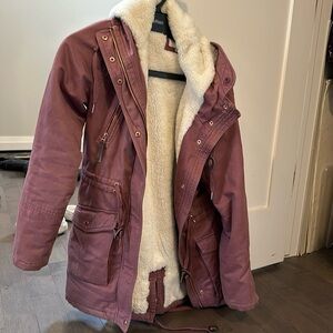 Rose coloured jacket. Faux fur lined. Rose gold zippers, cinch waist